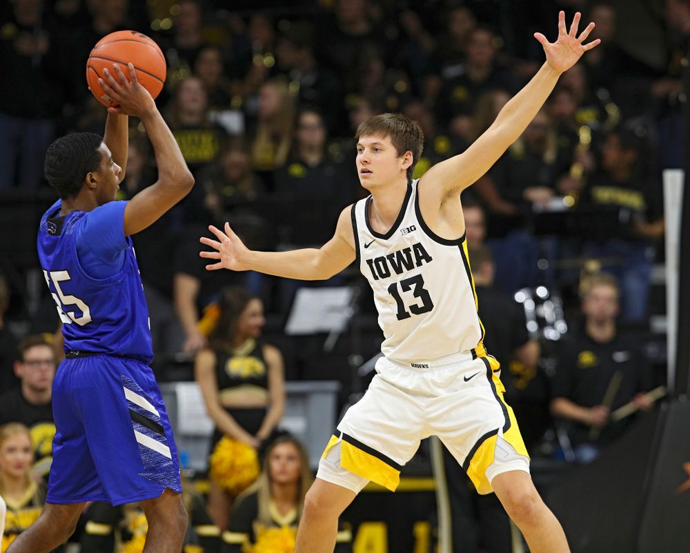 Iowa Hawkeyes guard Austin Ash (13) defends during the second half of their exhibition game against Lindsey Wilson College at Carver-Hawkeye Arena in Iowa City on Monday, Nov 4, 2019. (Stephen Mally/hawkeyesports.com)
