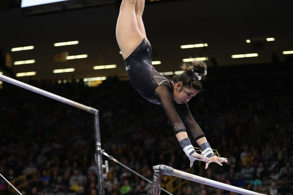 Iowa's Nicole Chow competes on the bars against Illinois Saturday, February 16, 2019 at Carver-Hawkeye Arena. (Brian Ray/hawkeyesports.com)