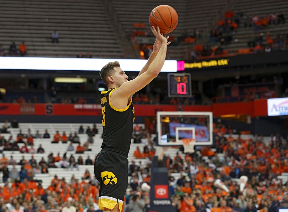 Iowa Hawkeyes guard Jordan Bohannon (3) makes a 3-pointer during the second half of their ACC/Big Ten Challenge game at the Carrier Dome in Syracuse, N.Y. on Tuesday, Dec 3, 2019. (Stephen Mally/hawkeyesports.com)