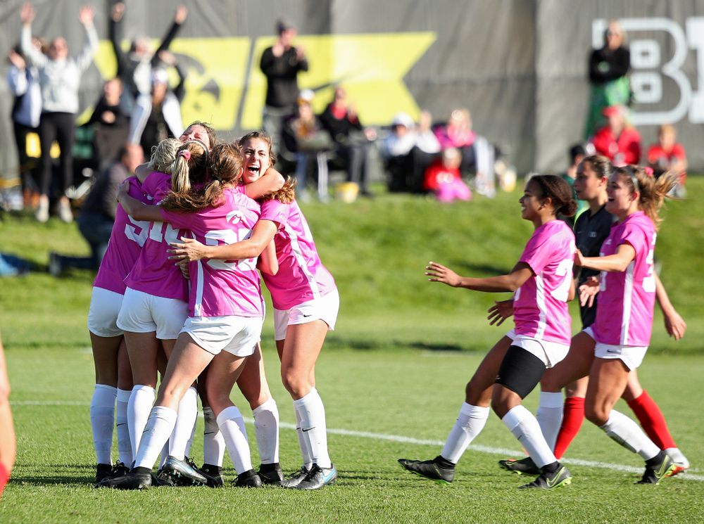 Iowa forward Samantha Tawharu (27) celebrates with her teammates after scoring the game winning golden goal during the second overtime of their match at the Iowa Soccer Complex in Iowa City on Sunday, Oct 27, 2019. (Stephen Mally/hawkeyesports.com)