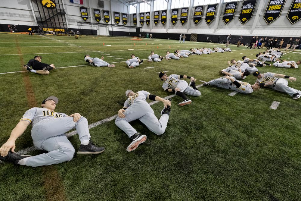 The Iowa Hawkeyes warm up for practice Tuesday, February 5, 2019 in the Indoor Practice Facility. (Brian Ray/hawkeyesports.com)
