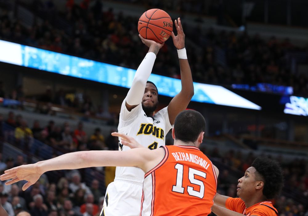 Iowa Hawkeyes guard Isaiah Moss (4) against the Illinois Fighting Illini in the 2019 Big Ten Men's Basketball Tournament Thursday, March 14, 2019 at the United Center in Chicago. (Brian Ray/hawkeyesports.com)