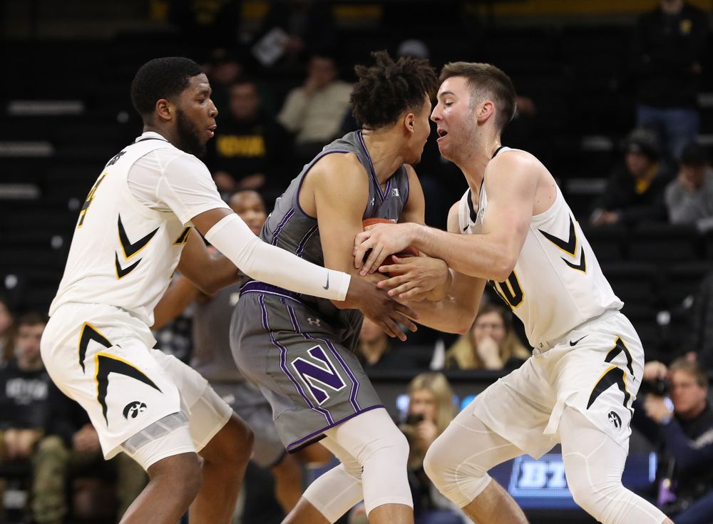 Iowa Hawkeyes guard Isaiah Moss (4) and guard Connor McCaffery (30) against the Northwestern Wildcats Sunday, February 10, 2019 at Carver-Hawkeye Arena. (Brian Ray/hawkeyesports.com)