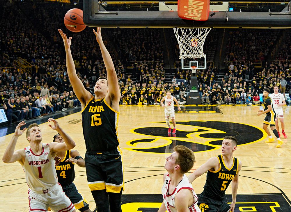Iowa Hawkeyes forward Ryan Kriener (15) pulls in a rebound during the first half of their game at Carver-Hawkeye Arena in Iowa City on Monday, January 27, 2020. (Stephen Mally/hawkeyesports.com)
