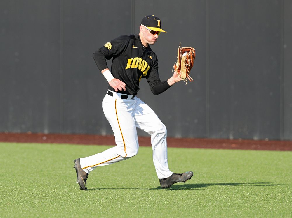 Iowa outfielder Ben Norman (9) fields a ball during the second inning of their college baseball game at Duane Banks Field in Iowa City on Tuesday, March 10, 2020. (Stephen Mally/hawkeyesports.com)
