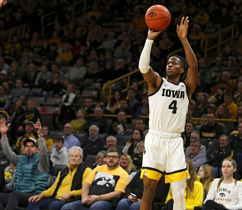 Iowa Hawkeyes guard Bakari Evelyn (4) makes a 3-pointer during the first half of their their game at Carver-Hawkeye Arena in Iowa City on Sunday, December 29, 2019. (Stephen Mally/hawkeyesports.com)