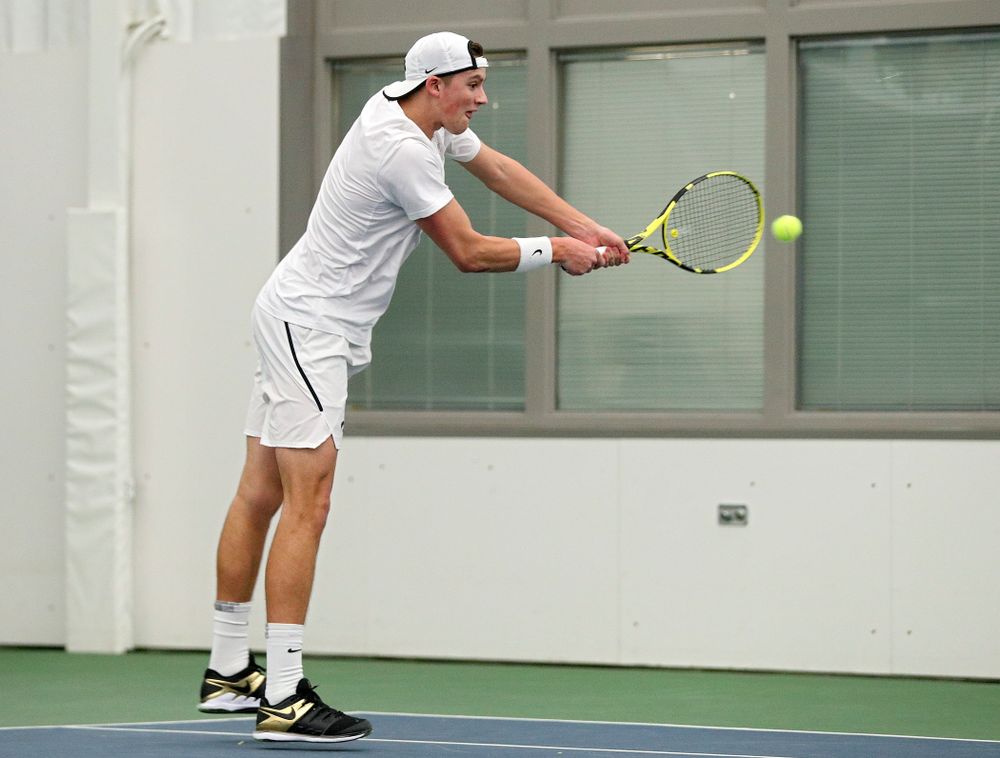 Iowa’s Joe Tyler returns a shot during his doubles match at the Hawkeye Tennis and Recreation Complex in Iowa City on Sunday, February 16, 2020. (Stephen Mally/hawkeyesports.com)