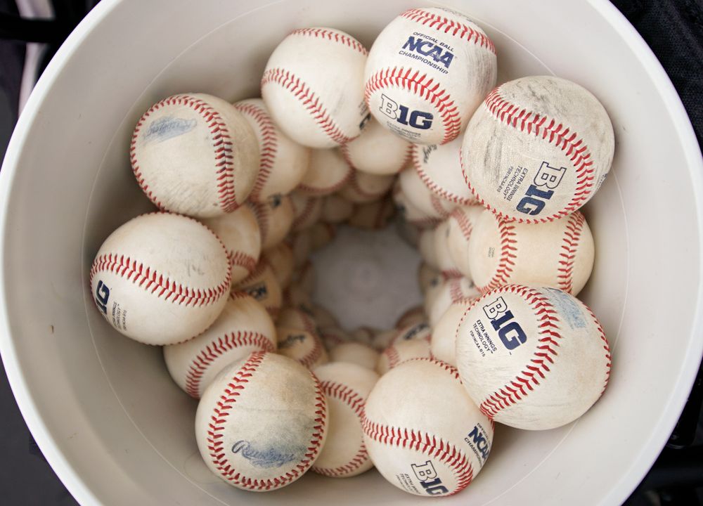 Big Ten baseballs sit in a bucket before the college baseball game at Duane Banks Field in Iowa City on Wednesday, March 11, 2020. (Stephen Mally/hawkeyesports.com)