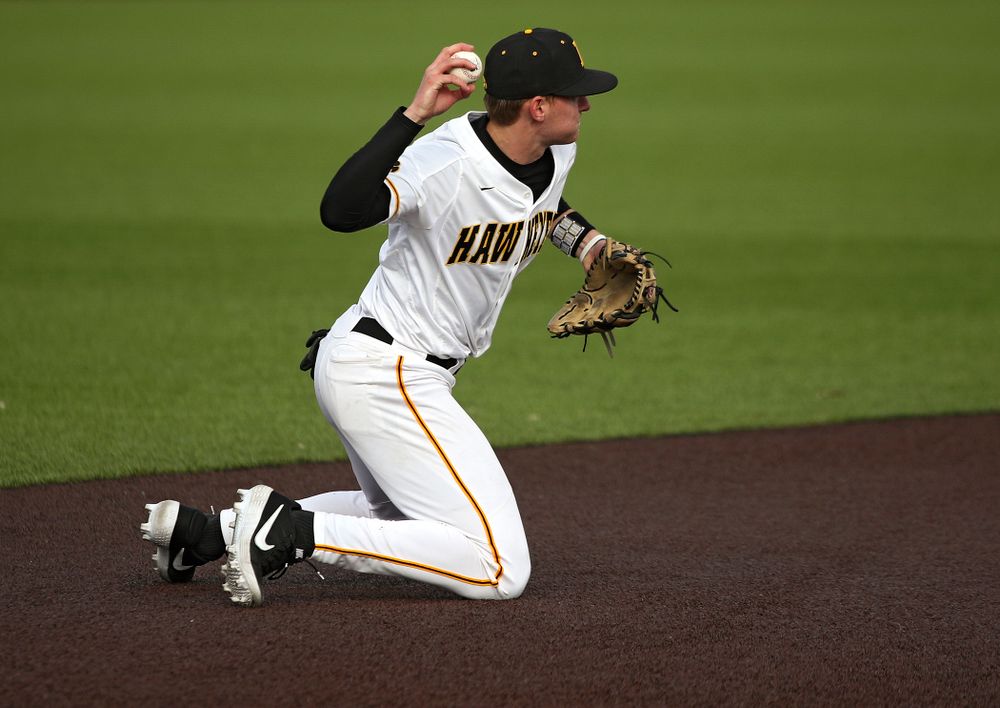 Iowa infielder Brendan Sher (2) throws to second base as they turn a double play during the eighth inning of their college baseball game at Duane Banks Field in Iowa City on Wednesday, March 11, 2020. (Stephen Mally/hawkeyesports.com)