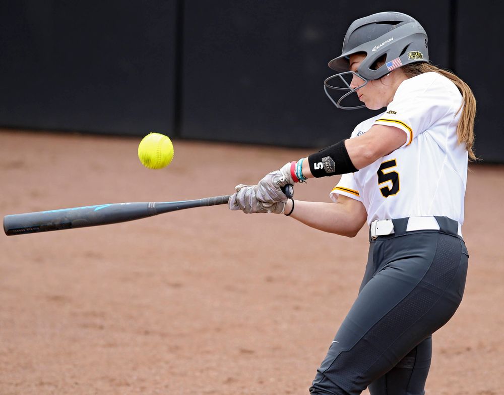 Iowa Hawkeyes Sydney Owens (5) connects on a pitch during the second inning of their Big Ten Conference softball game at Pearl Field in Iowa City on Friday, Mar. 29, 2019. (Stephen Mally/hawkeyesports.com)