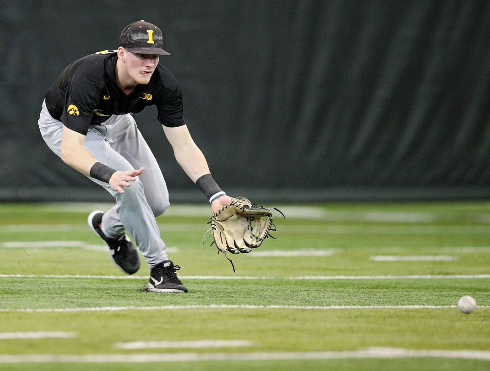 Iowa Hawkeyes infielder Brendan Sher (2) fields a ball during practice at the Hansen Football Performance Center in Iowa City on Friday, January 24, 2020. (Stephen Mally/hawkeyesports.com)