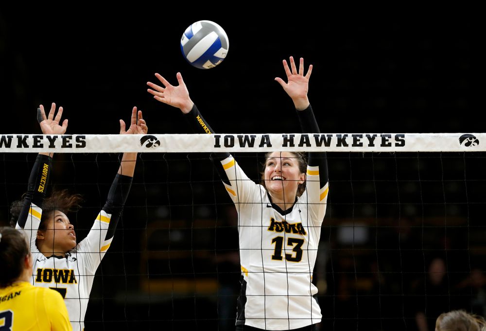 Iowa Hawkeyes middle blocker Sarah Wing (13) and setter Gabrielle Orr (7) against the Michigan Wolverines Sunday, September 23, 2018 at Carver-Hawkeye Arena. (Brian Ray/hawkeyesports.com)