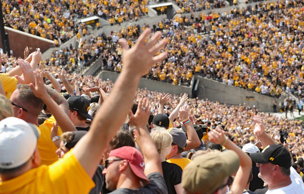 People look wave to the the University of Iowa Stead Family Children's Hospital as the Pat Green performs “Wave on Wave” during the second quarter of their Big Ten Conference football game at Kinnick Stadium in Iowa City on Saturday, Sep 7, 2019. (Stephen Mally/hawkeyesports.com)