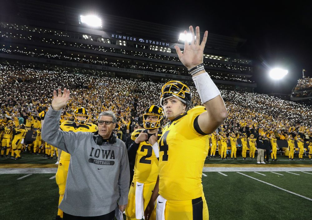 Iowa Hawkeyes quarterback Nate Stanley (4) and quarterbacks coach Ken O'Keefe  wave to the Stead Family ChildrenÕs Hospital against the Penn State Nittany Lions Saturday, October 12, 2019 at Kinnick Stadium. (Brian Ray/hawkeyesports.com)