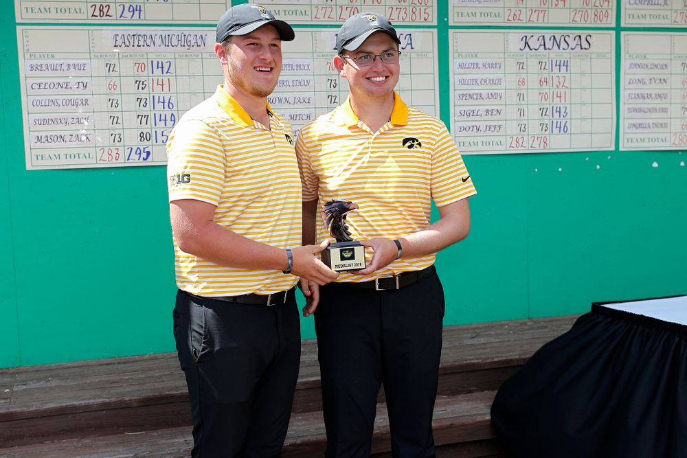 Iowa's Alex Schaake (from left) and Matthew Walker hold their trophy after winning the Hawkeye Invitational at Finkbine Golf Course in Iowa City on Sunday, Apr. 21, 2019. (Stephen Mally/hawkeyesports.com)