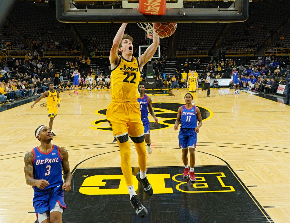 Iowa Hawkeyes forward Patrick McCaffery (22) dunks the ball during the second half of their game at Carver-Hawkeye Arena in Iowa City on Monday, Nov 11, 2019. (Stephen Mally/hawkeyesports.com)