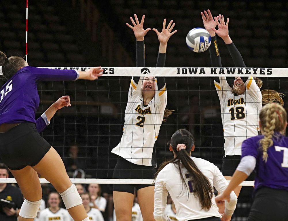 Iowa’s Hannah Clayton (18) gets a block as Courtney Buzzerio (2) looks on during their Big Ten/Pac-12 Challenge match at Carver-Hawkeye Arena in Iowa City on Saturday, Sep 7, 2019. (Stephen Mally/hawkeyesports.com)