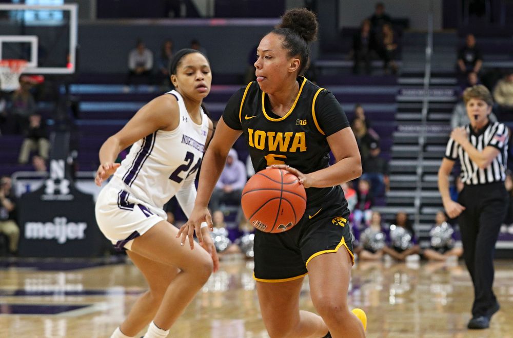 Iowa Hawkeyes guard Alexis Sevillian (5) drives with the ball during the third quarter of their game at Welsh-Ryan Arena in Evanston, Ill. on Sunday, January 5, 2020. (Stephen Mally/hawkeyesports.com)