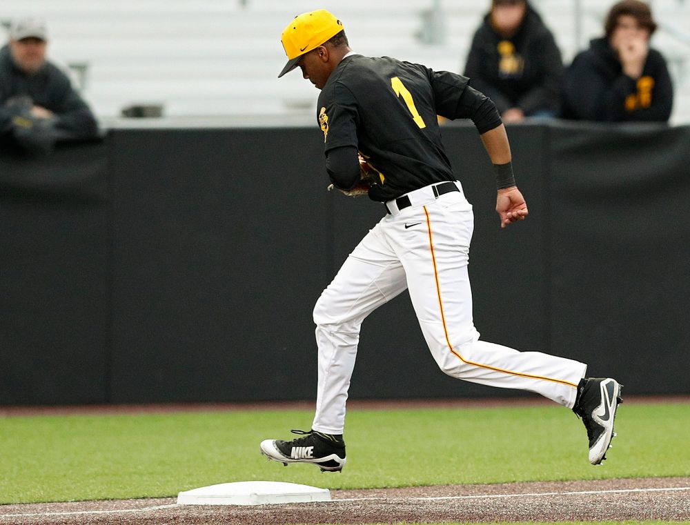 Iowa Hawkeyes third baseman Lorenzo Elion (1) steps on third base after fielding a ground ball to get the third out during the third inning of their game against Western Illinois at Duane Banks Field in Iowa City on Wednesday, May. 1, 2019. (Stephen Mally/hawkeyesports.com)