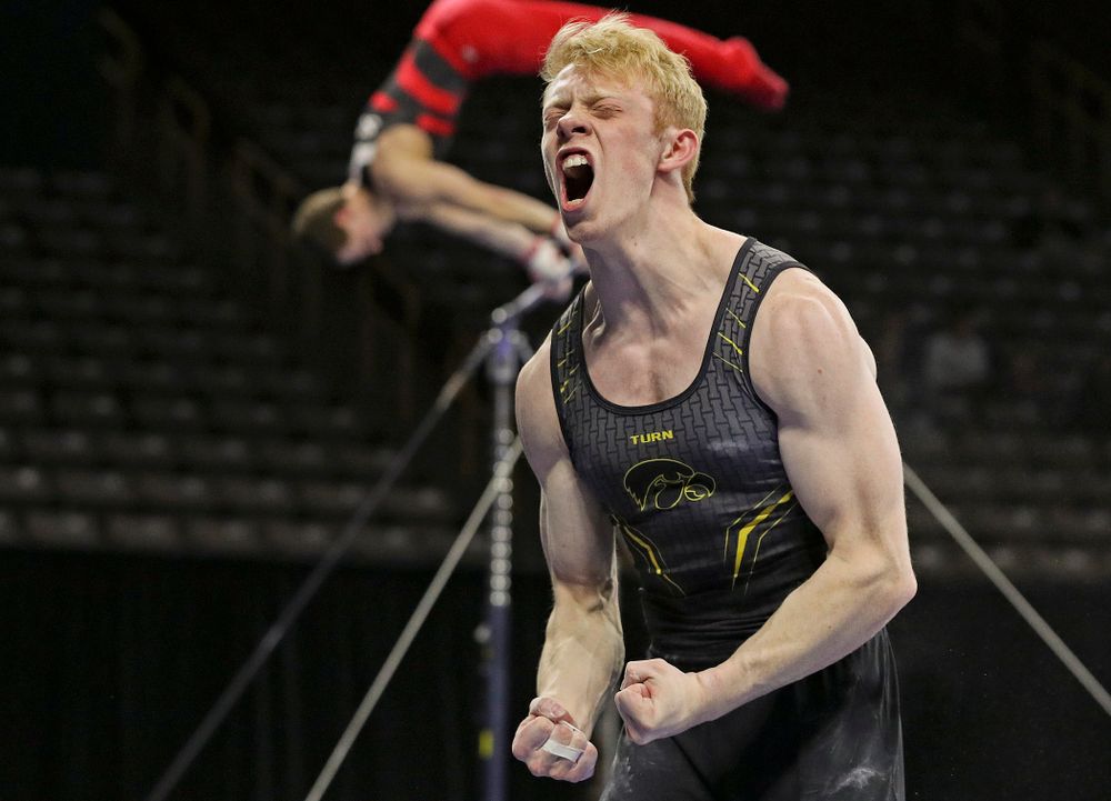 Iowa's Nick Merryman is pumped up after competing in the parallel bars during the first day of the Big Ten Men's Gymnastics Championships at Carver-Hawkeye Arena in Iowa City on Friday, Apr. 5, 2019. (Stephen Mally/hawkeyesports.com)