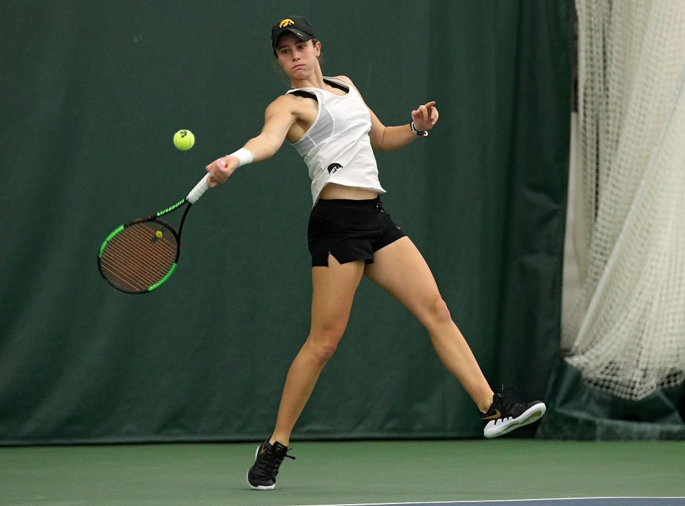 Iowa’s Elise Van Heuvelen returns a shot during her singles match at the Hawkeye Tennis and Recreation Complex in Iowa City on Sunday, February 23, 2020. (Stephen Mally/hawkeyesports.com)
