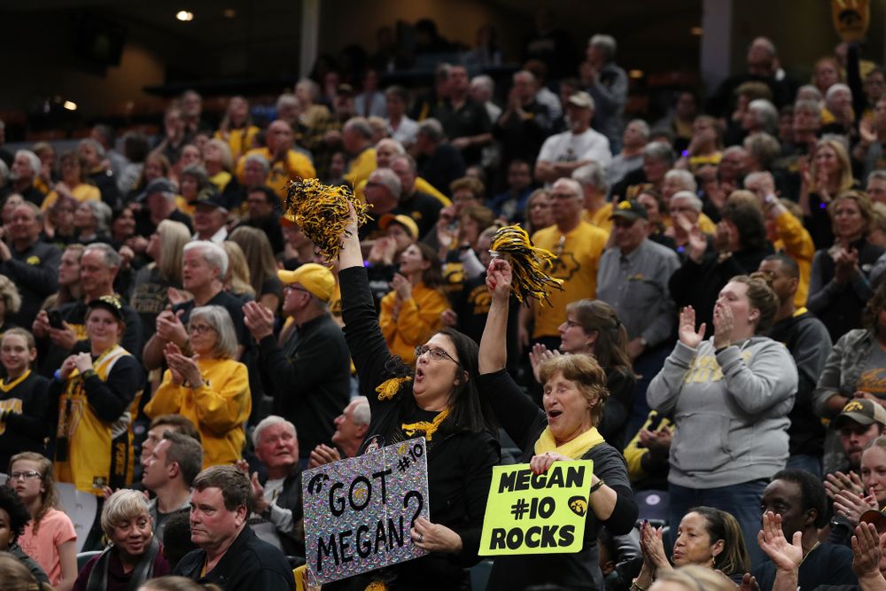 Eva Gustafson and the rest of the fans cheer for the Iowa Hawkeyes against the Indiana Hoosiers in the quarterfinals of the Big Ten Tournament Friday, March 8, 2019 at Bankers Life Fieldhouse in Indianapolis, Ind. (Brian Ray/hawkeyesports.com)