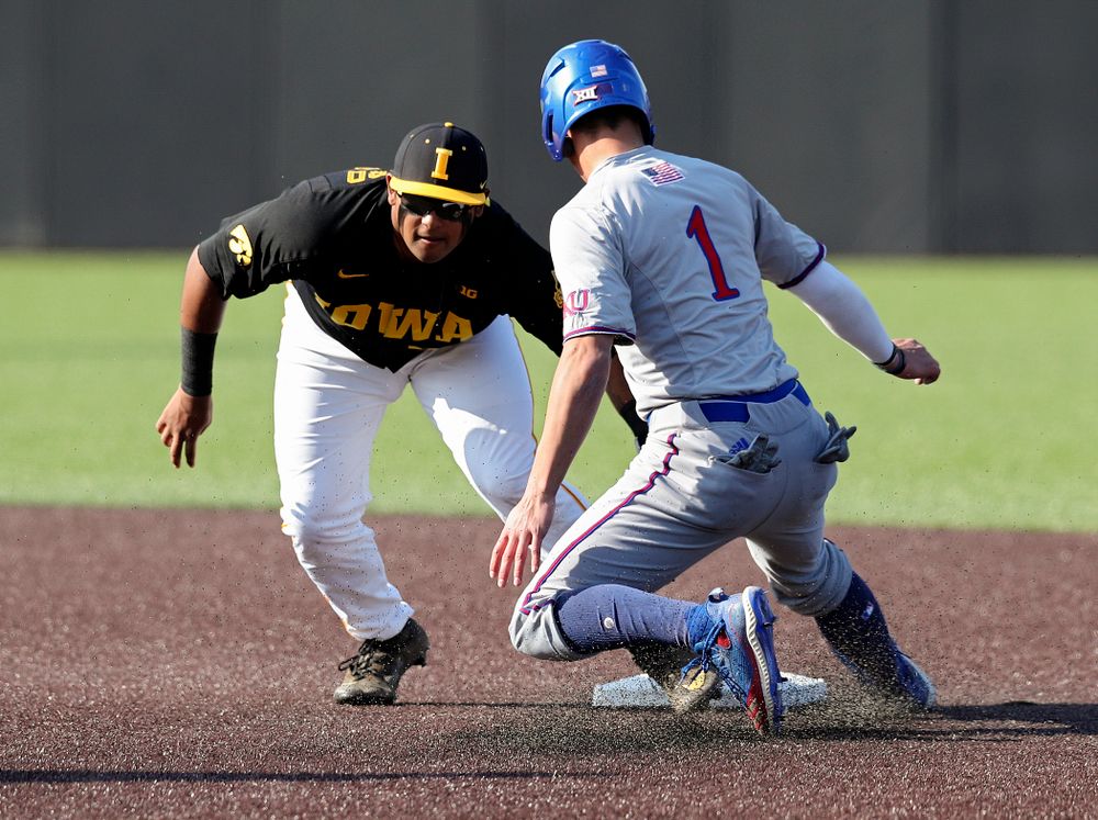 Iowa infielder Izaya Fullard (20) tags out a runner trying to steal second during the first inning of their college baseball game at Duane Banks Field in Iowa City on Tuesday, March 10, 2020. (Stephen Mally/hawkeyesports.com)