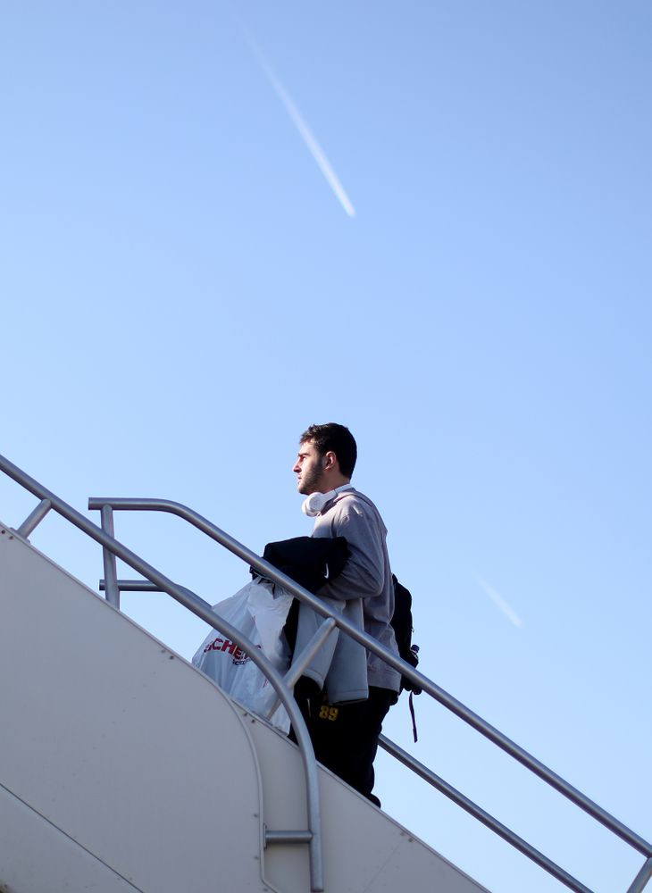 Iowa Hawkeyes wide receiver Nico Ragaini (89) boards the team plane at the Eastern Iowa Airport Saturday, December 21, 2019 on the way to San Diego, CA for the Holiday Bowl. (Brian Ray/hawkeyesports.com)
