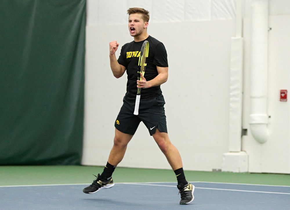 Iowa’s Will Davies celebrates after winning his singles match at the Hawkeye Tennis and Recreation Complex in Iowa City on Friday, February 14, 2020. (Stephen Mally/hawkeyesports.com)
