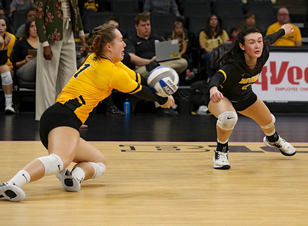 Iowa’s Joslyn Boyer (1) dives for a dig as Halle Johnston (4) tries to reach the ball during their match at Carver-Hawkeye Arena in Iowa City on Sunday, Oct 20, 2019. (Stephen Mally/hawkeyesports.com)