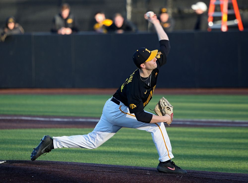 Iowa pitcher Cam Baumann (35) delivers to the plate during the fourth inning of their game at Duane Banks Field in Iowa City on Tuesday, March 3, 2020. (Stephen Mally/hawkeyesports.com)