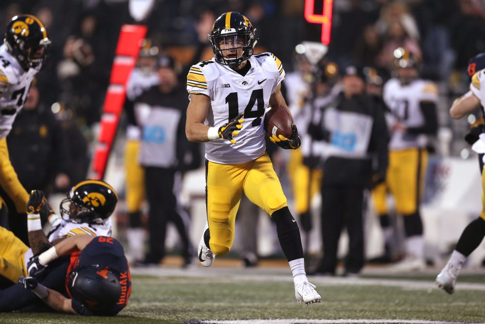 Iowa Hawkeyes wide receiver Kyle Groeneweg (14) returns a punt for a touchdown against the Illinois Fighting Illini Saturday, November 17, 2018 at Memorial Stadium in Champaign, Ill. (Brian Ray/hawkeyesports.com)