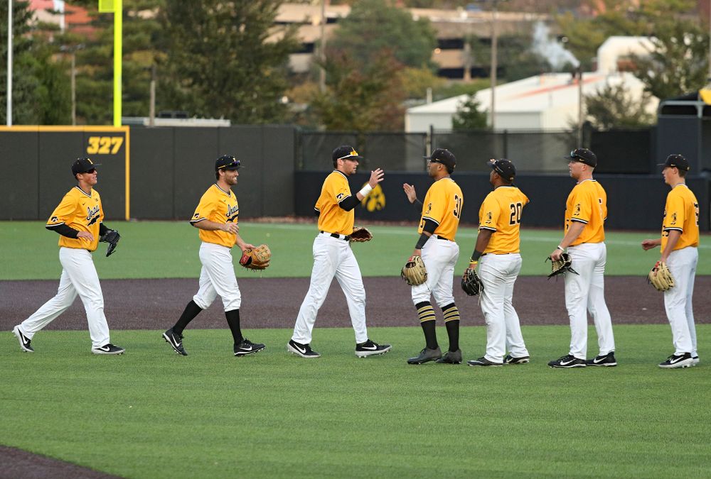 The Gold Team celebrates after winning the first game of the Black and Gold Fall World Series at Duane Banks Field in Iowa City on Tuesday, Oct 15, 2019. (Stephen Mally/hawkeyesports.com)