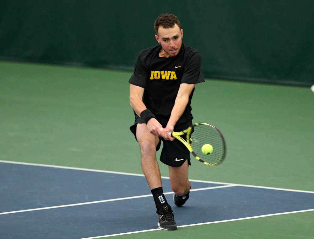 Iowa’s Kareem Allaf returns a shot during his doubles match at the Hawkeye Tennis and Recreation Complex in Iowa City on Friday, March 6, 2020. (Stephen Mally/hawkeyesports.com)