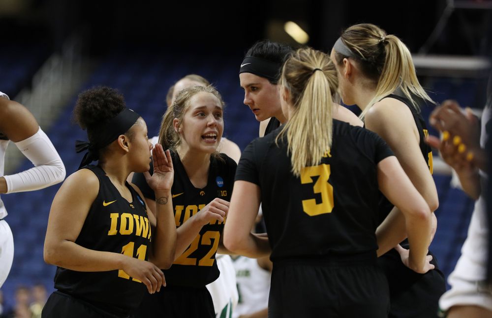 Iowa Hawkeyes guard Tania Davis (11), guard Kathleen Doyle (22), and forward Megan Gustafson (10) against the Baylor Lady Bears in the regional final of the 2019 NCAA Women's College Basketball Tournament Monday, April 1, 2019 at Greensboro Coliseum in Greensboro, NC.(Brian Ray/hawkeyesports.com)