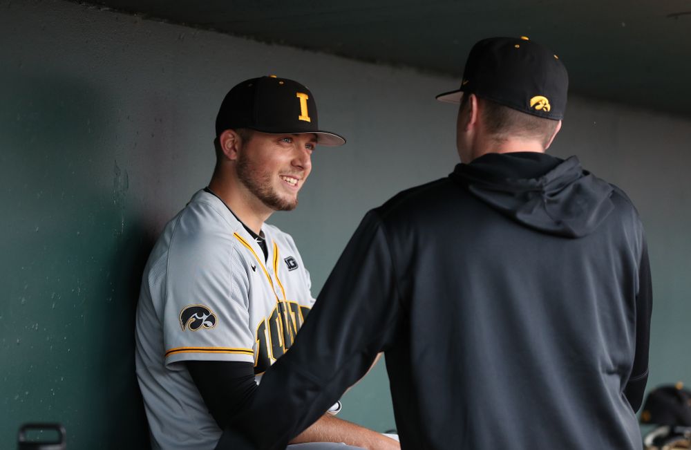 Iowa Hawkeyes Cole McDonald (11) talks with pitching coach Tom Gorzelanny against the Indiana Hoosiers in the first round of the Big Ten Baseball Tournament Wednesday, May 22, 2019 at TD Ameritrade Park in Omaha, Neb. (Brian Ray/hawkeyesports.com)