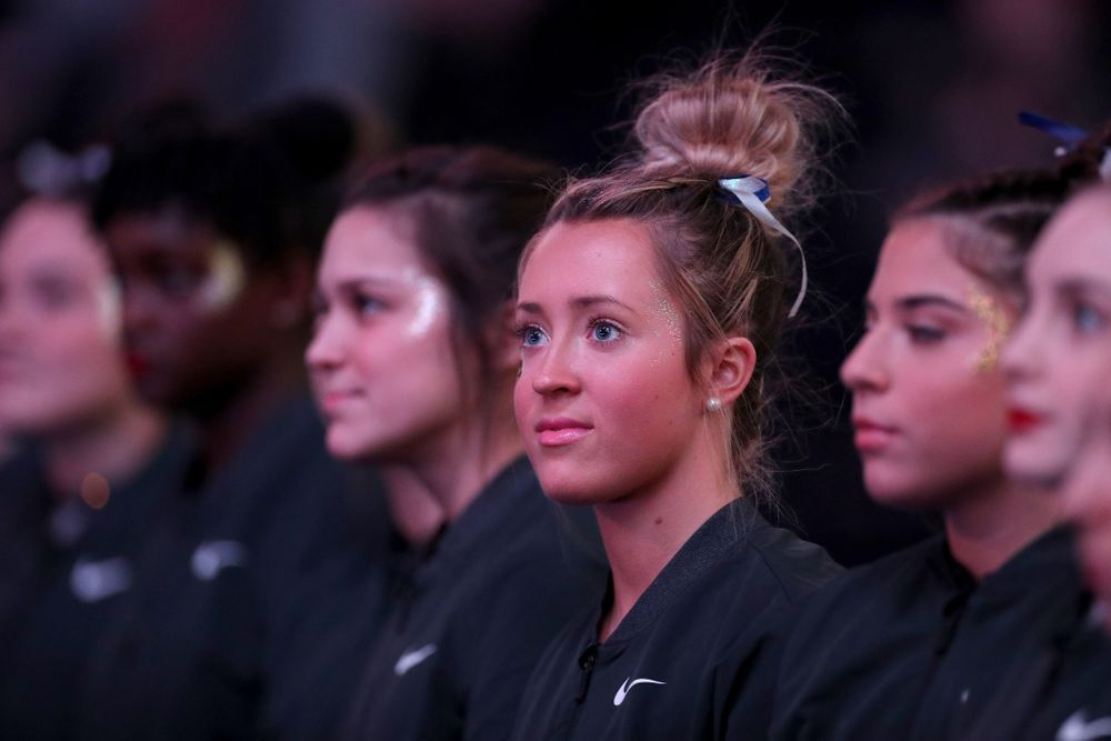 Iowa’s Maddie Kampschroeder stands for the National Anthem before their meet against Michigan State Saturday, February 1, 2020 at Carver-Hawkeye Arena. (Brian Ray/hawkeyesports.com)