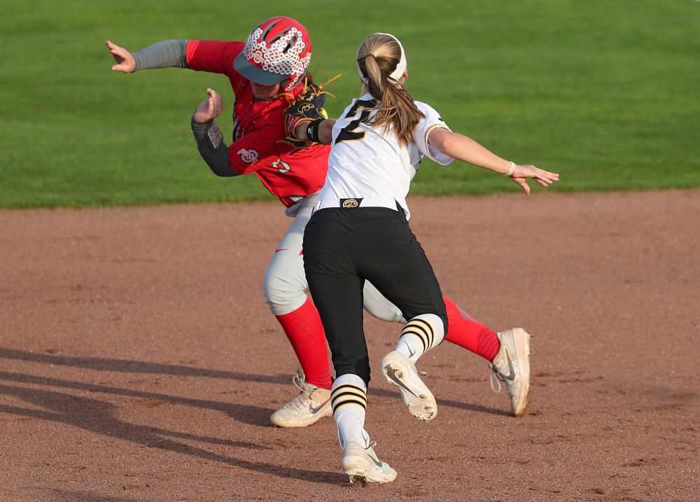 Iowa second baseman Aralee Bogar (2) tags out a runner as she turns an inning ending double play during the sixth inning of their game against Ohio State at Pearl Field in Iowa City on Friday, May. 3, 2019. (Stephen Mally/hawkeyesports.com)