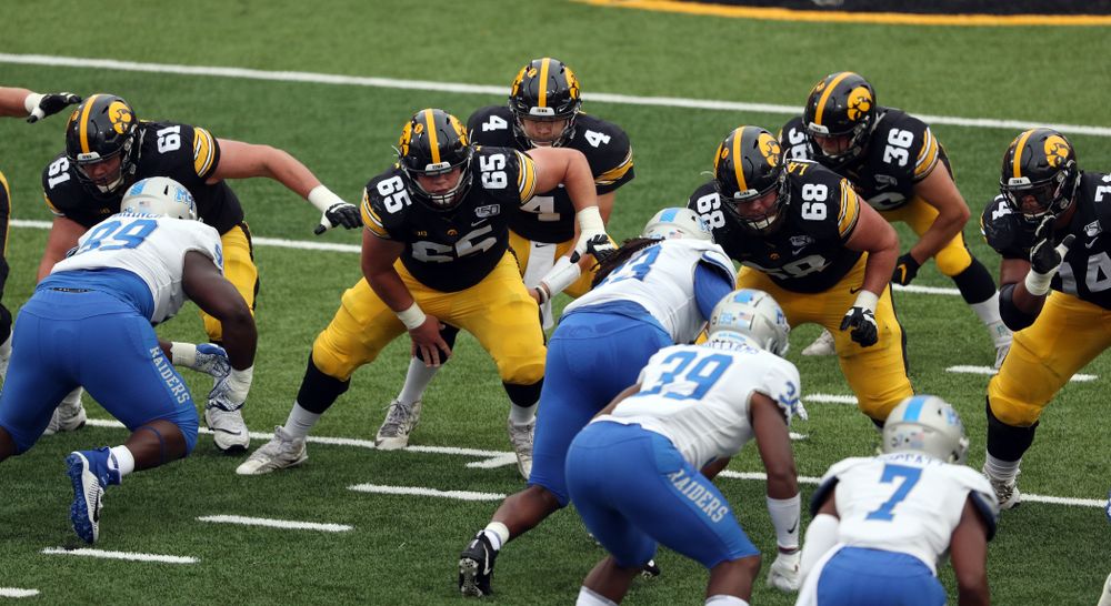 Iowa Hawkeyes offensive lineman Cole Banwart (61), offensive lineman Tyler Linderbaum (65), offensive lineman Landan Paulsen (68), and offensive lineman Tristan Wirfs (74) against Middle Tennessee State Saturday, September 28, 2019 at Kinnick Stadium. (Brian Ray/hawkeyesports.com)