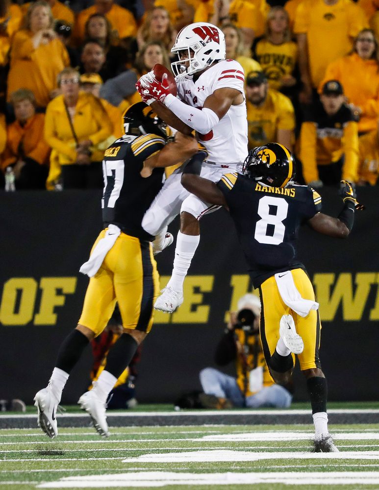 Iowa Hawkeyes defensive back Amani Hooker (27) and Iowa Hawkeyes defensive back Matt Hankins (8) break up a pass during a game against Wisconsin at Kinnick Stadium on September 22, 2018. (Tork Mason/hawkeyesports.com)