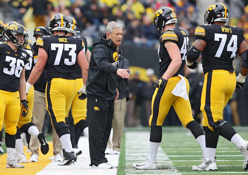Iowa Hawkeyes head coach Kirk Ferentz greets tight end Shaun Beyer (42) during the first quarter of their game at Kinnick Stadium in Iowa City on Saturday, Oct 19, 2019. (Stephen Mally/hawkeyesports.com)