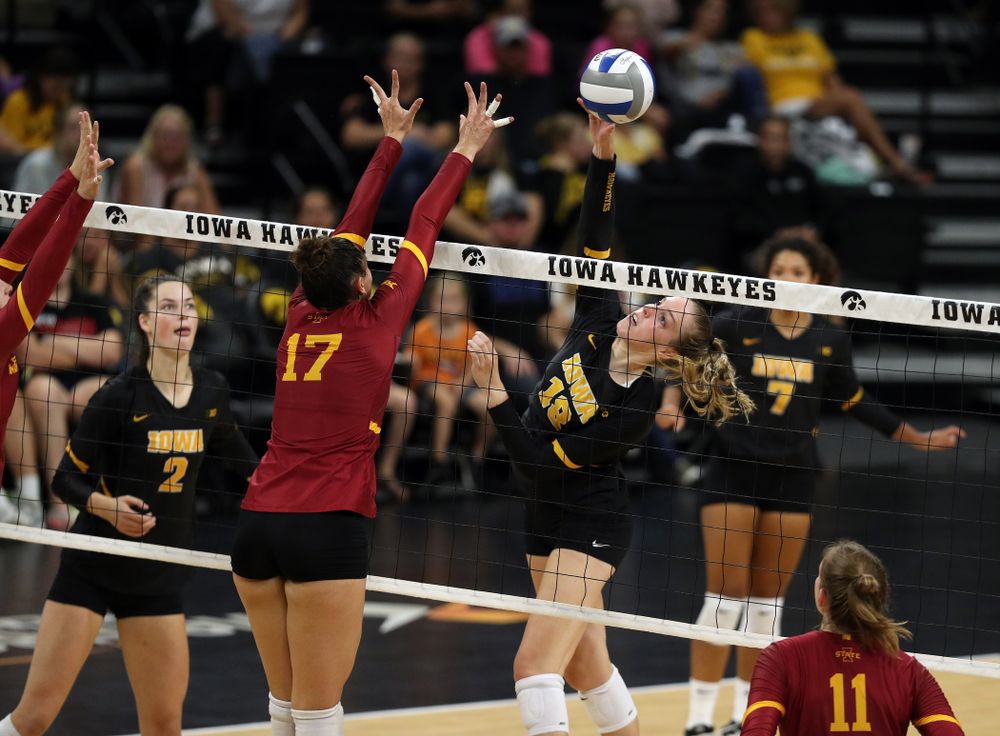 Iowa Hawkeyes middle blocker Hannah Clayton (18) hits the ball against the Iowa State Cyclones Saturday, September 21, 2019 during the Iowa Corn Cy-Hawk Series Tournament at Carver-Hawkeye Arena. (Brian Ray/hawkeyesports.com)