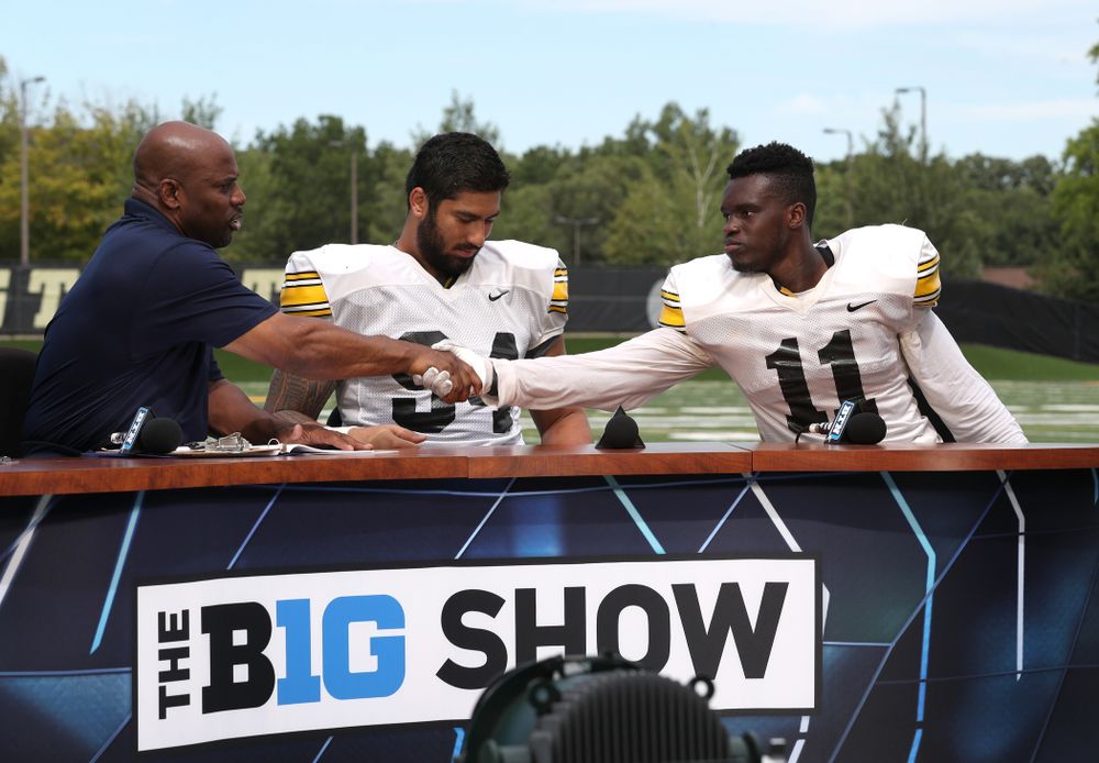 Iowa Hawkeyes defensive end A.J. Epenesa (94) and defensive back Michael Ojemudia (11) on the set of the BTN Tailgate Tour following fall camp Practice No. 16 Tuesday, August 20, 2019 at the Ronald D. and Margaret L. Kenyon Football Practice Facility. (Brian Ray/hawkeyesports.com)