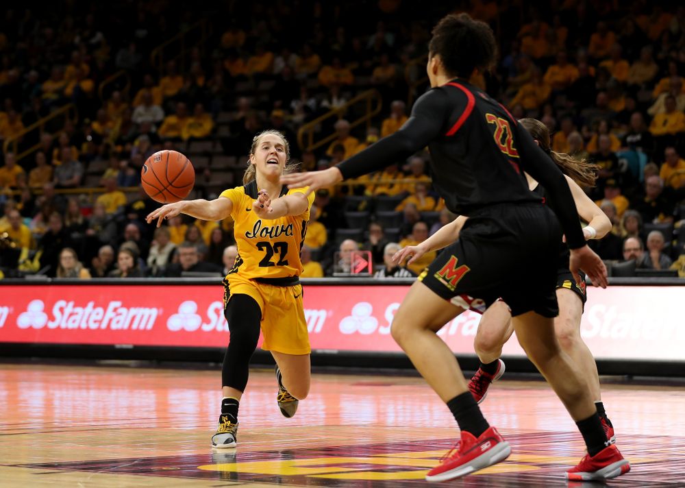 Iowa Hawkeyes guard Kathleen Doyle (22) dishes off a pass against the Maryland Terrapins Thursday, January 9, 2020 at Carver-Hawkeye Arena. (Brian Ray/hawkeyesports.com)