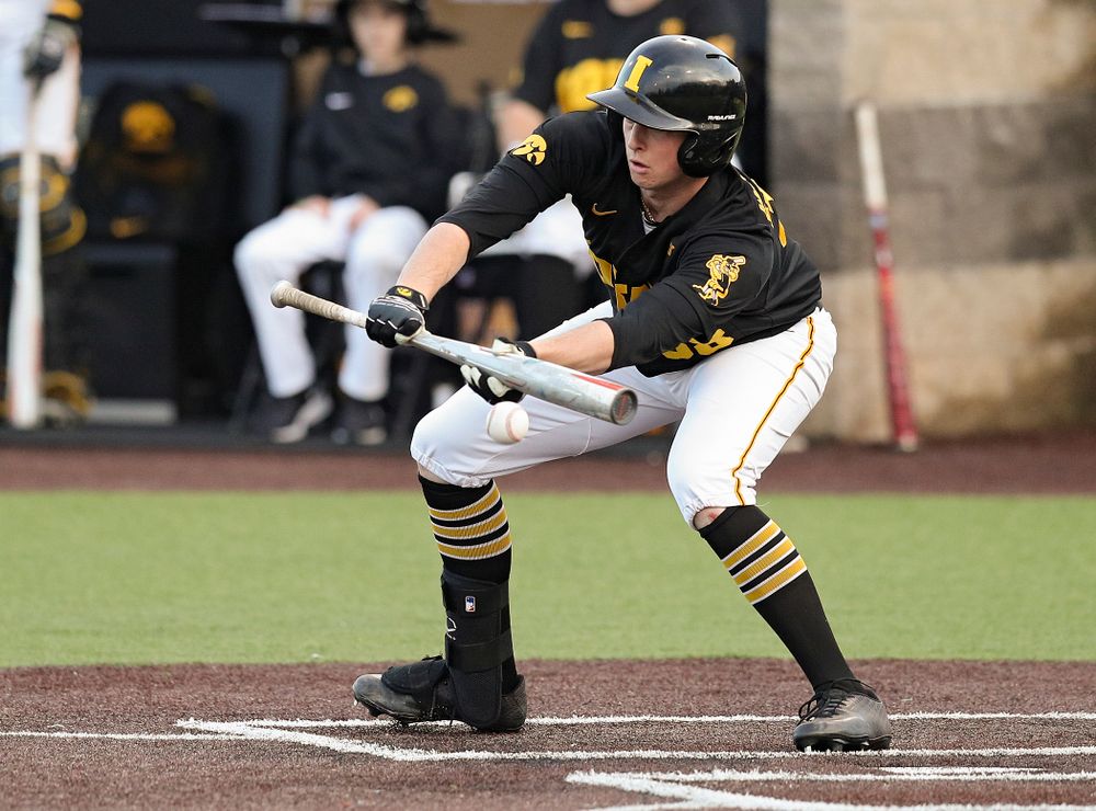 Iowa designated hitter Trenton Wallace (38) bunts the ball for a single during the seventh inning of their college baseball game at Duane Banks Field in Iowa City on Tuesday, March 10, 2020. (Stephen Mally/hawkeyesports.com)
