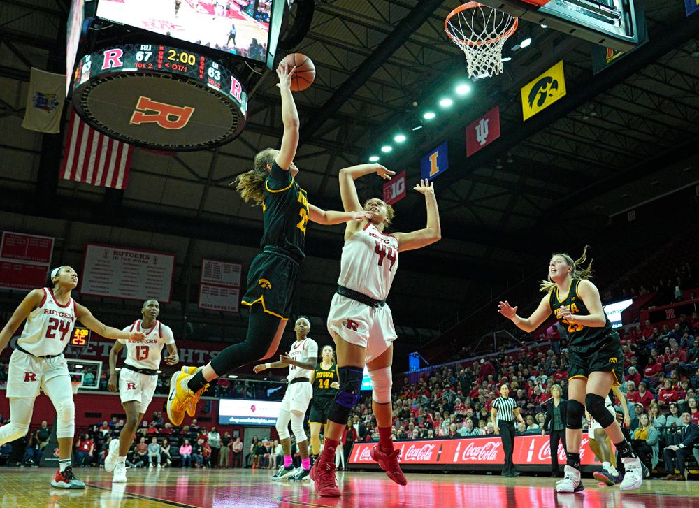 Iowa guard Kathleen Doyle (22) puts up a shot during overtime of their game at the Rutgers Athletic Center in Piscataway, N.J. on Sunday, March 1, 2020. (Stephen Mally/hawkeyesports.com)