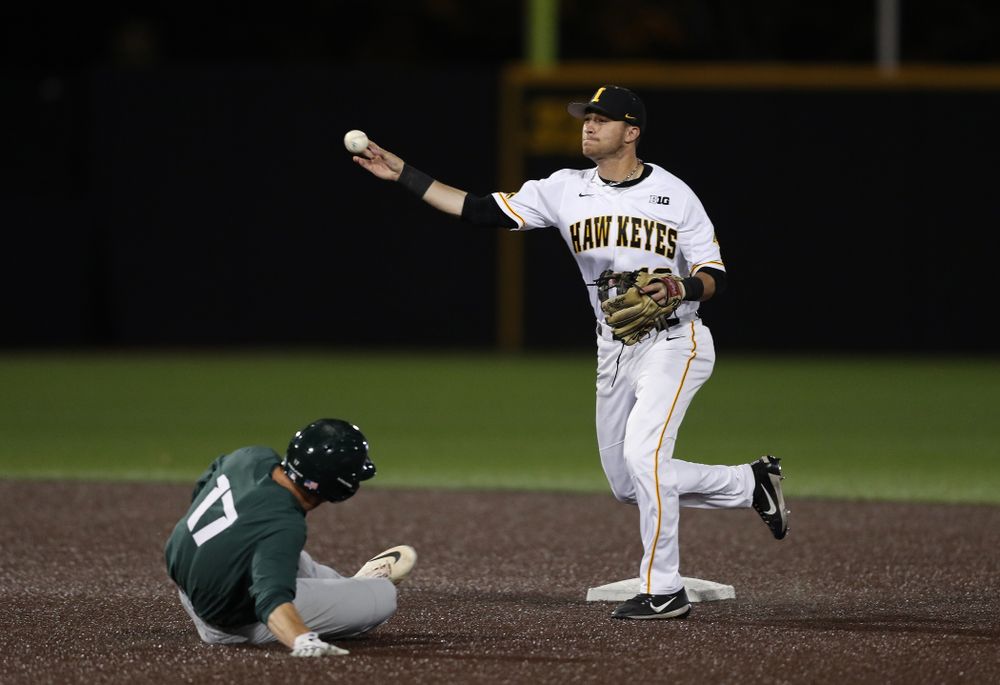 Iowa Hawkeyes Tanner Wetrich (16) turns a double play against the Michigan State Spartans Friday, May 10, 2019 at Duane Banks Field. (Brian Ray/hawkeyesports.com)