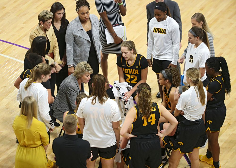 Iowa Hawkeyes head coach Lisa Bluder talks with her team during a timeout in the fourth quarter of their game at Welsh-Ryan Arena in Evanston, Ill. on Sunday, January 5, 2020. (Stephen Mally/hawkeyesports.com)