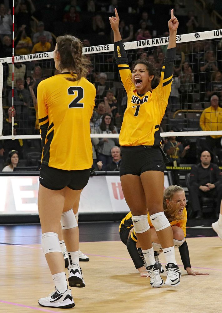 Iowa’s Courtney Buzzerio (2), Brie Orr (7), and Hannah Clayton (18) celebrate a score during their match at Carver-Hawkeye Arena in Iowa City on Sunday, Oct 20, 2019. (Stephen Mally/hawkeyesports.com)