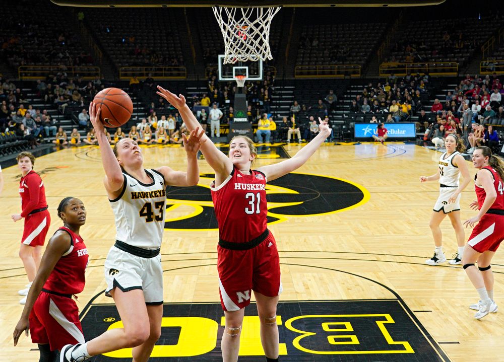Iowa Hawkeyes forward Amanda Ollinger (43) makes a basket during the fourth quarter of the game at Carver-Hawkeye Arena in Iowa City on Thursday, February 6, 2020. (Stephen Mally/hawkeyesports.com)